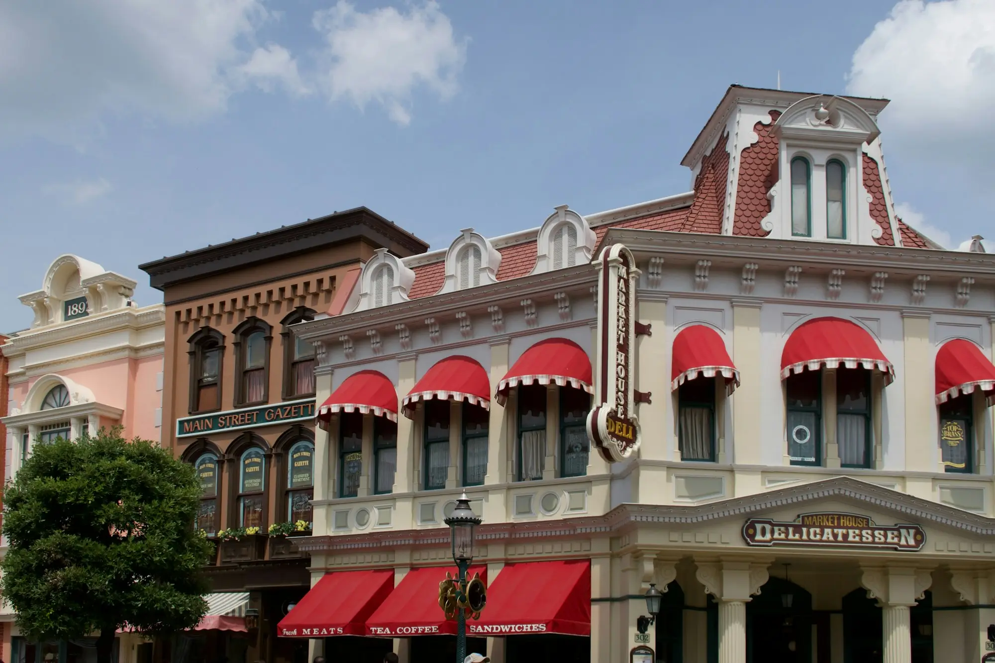 Heritage shopfronts with red awnings on a main street